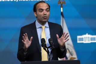 FILE - Consumer Financial Protection Bureau Director Rohit Chopra, speaks from the South Court Auditorium on the White House complex in Washington, April 11, 2022, about medical debt during an event with Vice President Kamala Harris. Nursing homes and debt collectors are flouting a law that prohibits them from requiring friends and family of care home residents to shoulder the costs of the facilities, according to a federal report issued Thursday. (AP Photo/Jacquelyn Martin, File)