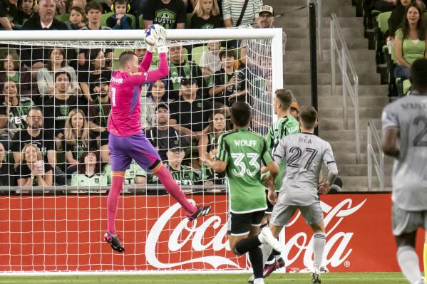 Austin FC goalkeeper Brad Stuver makes a save during the first half of an MLS soccer game against CF Montreal, Saturday, March 4, 2023, in Austin, Texas. Austin won 1-0. (AP Photo/Michael Thomas)