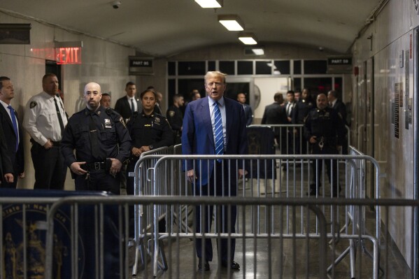 Former President Donald Trump addresses the media following the second day of jury selection, Tuesday, April 16, 2024, at Manhattan criminal court in New York. Trump is charged with falsifying business records to cover up a sex scandal during his 2016 campaign. (Justin Lane/Pool Photo via AP)