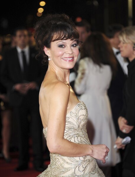 FILE - Helen McCrory arrives at the world premiere of "Skyfall" in London on Oct. 23, 2012. McCrory, who starred in the television show “Peaky Blinders” and the “Harry Potter” movies, has died. She was 52 and had been suffering from cancer. Her husband, actor Damian Lewis, said Friday that McCrory died “peacefully at home” after a "heroic battle with cancer.” (Photo by Stewart Wilson/Invision/AP, File)