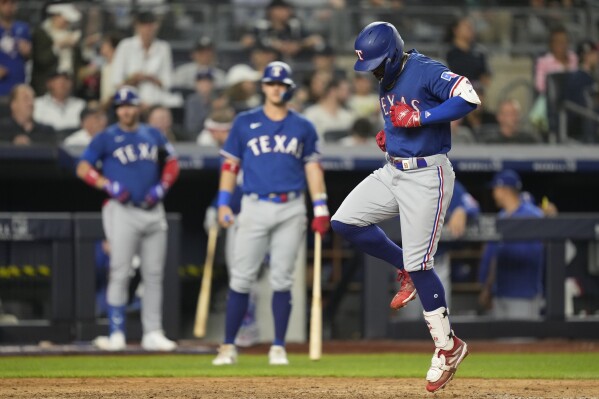 García's 2-run homer in the 10th lifts the Rangers over the struggling