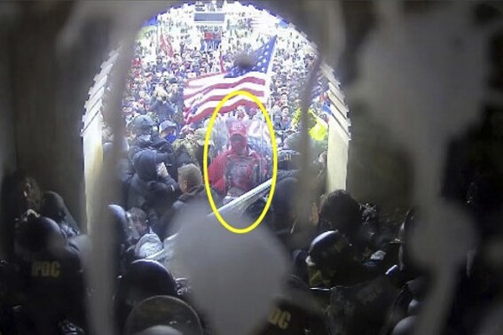 This image from police body-worn video and contained in the Justice Department statement of facts supporting the arrest of Rally Runner, shows Rally Runner outside the U.S. Capitol on Jan. 6, 2021, in Washington. Rally Runner, who legally changed his name from Daniel Donnelly Jr., pleaded guilty on Friday, March 22, 2024, to a felony charge of civil disorder and is scheduled to be sentenced in July. (Department of Justice via AP)