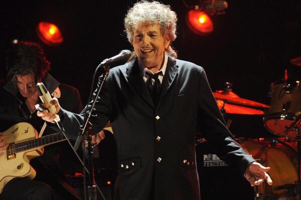 FILE - Bob Dylan performs in Los Angeles on  Jan. 12, 2012. Dylan has a new book coming out this fall, a collection of more than 60 essays about songs and songwriters he admires, from Stephen Foster to Elvis Costello. The new book called “The Philosophy of Modern Song,” is scheduled for Nov. 8. (AP Photo/Chris Pizzello, File)