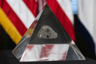 FILE - In this Monday, May 3, 2021, file photo, a fragment of the moon rock collected by astronaut John Young, commander of the Apollo 16 lunar mission, is displayed, in Washington. Louisiana has recovered a moon rock that was gifted to the state to commemorate the last manned U.S. mission to the moon, but then went missing. The Advocate of Baton Rouge reports that the rock from the 1972 Apollo 17 landing was in the hands of the Louisiana State Museum on Tuesday., Sept. 28, 2021. (AP Photo/Manuel Balce Ceneta, File)