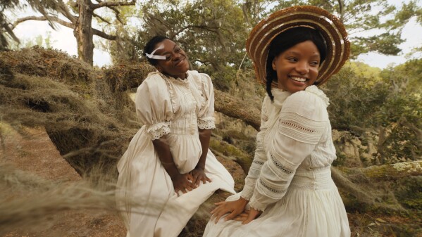 This image released by Warner Bros. Pictures shows Phylicia Pearl Mpasi, left, and Halle Bailey in a scene from "The Color Purple." (Warner Bros. Pictures via AP)