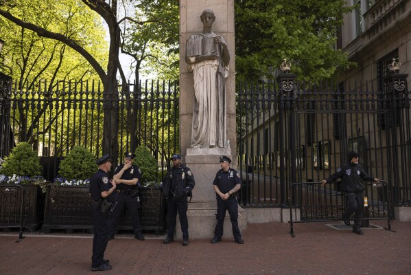 Police officers stand guard outside Columbia University, Thursday, May 2, 2024, in New York. (AP Photo/Yuki Iwamura, File)