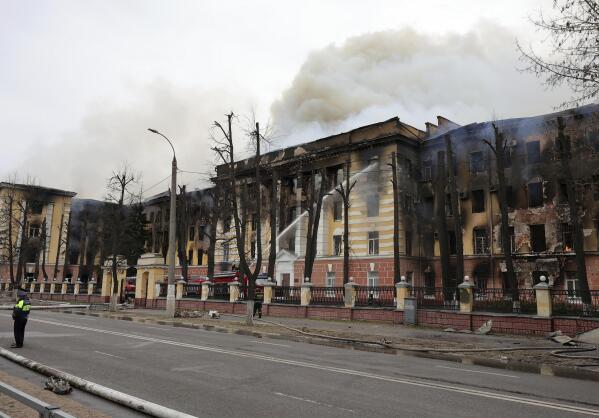 Firefighters hose down the burning building of the Central Research Institute of the Aerospace Defense Forces in the Russian city of Tver, Russia, Thursday, April 21, 2022. The press service of the local administration announced later in a statement that six people were killed and at least 27 were injured and over 10 people may be still trapped inside the building. (Vitaliy Smolnikov/Kommersant Publishing House via AP) RUSSIA OUT