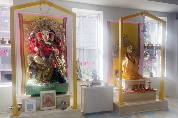 Statues of Lord Ganesha, left, and Shirdi Sai Baba are seen at Broome Street Ganesha Temple in the Manhattan borough of New York on Sept. 14, 2023. Founded by yoga teacher Eddie Stern in 2001, the temple pitches itself not strictly as a Hindu house of worship but as a sanctuary where passersby can find a few minutes of peace amid the chaos of New York. (Richa Karmarkar/RNS via AP)