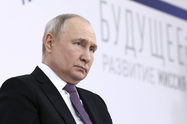 Russian President Vladimir Putin attends a forum titled 