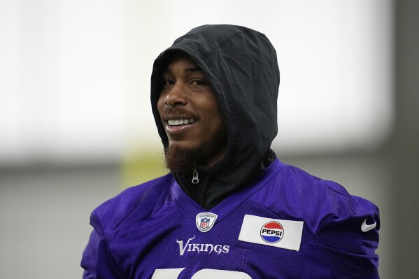 Minnesota Vikings wide receiver Justin Jefferson (18) walks across the field during an NFL football team practice Wednesday, May 28, 2025, in Eagan, Minn. (AP Photo/Abbie Parr)