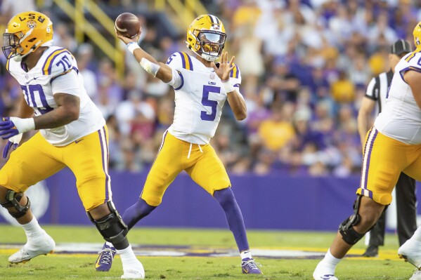 LSU quarterback Jayden Daniels (5) throws a pass during an NCAA college football game against Auburn in Baton Rouge, La., Saturday, Oct. 14, 2023. (Scott Clause/The Daily Advertiser via AP)