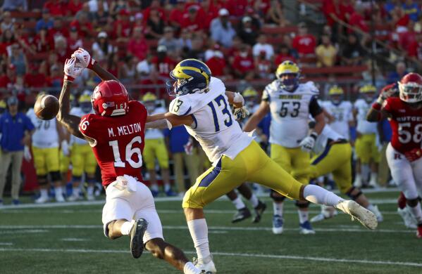 Rutgers defensive back Max Melton (16) makes a play on a pass intended for Delaware wide receiver Brett Buckman (13) during the second half of an NCAA college football game, Saturday, Sept. 18, 2021, in Piscataway, N.J. Rutgers won, 45-13. (Andrew Mills/NJ Advance Media via AP)