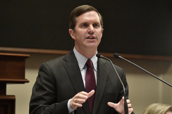 FILE - Kentucky Gov. Andy Beshear speaks to a joint session of the state Legislature to deliver his State of the Commonwealth address in the House chambers of the state Capitol, Jan. 3, 2024, in Frankfort, Ky. Beshear vowed Thursday, March 14, to relentlessly oppose a proposed school choice constitutional amendment moving closer to reaching the general election ballot in Kentucky. (AP Photo/Timothy D. Easley, File)