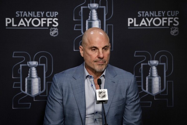 Vancouver Canucks head coach Rick Tocchet speaks during a news conference after Game 7 of an NHL hockey Stanley Cup second-round playoff series against the Edmonton Oilers in Vancouver, British Columbia, on Monday, May 20, 2024. (Ethan Cairns/The Canadian Press via AP)