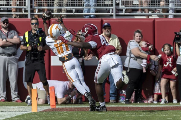 Tennessee wide receiver Squirrel White (10) grabs a touchdown pass as Alabama linebacker Chris Braswell (41) defends during the first half of an NCAA college football game, Saturday, Oct. 21, 2023, in Tuscaloosa, Ala. (AP Photo/Vasha Hunt)