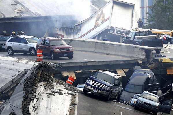 FILE - In this Wednesday, Aug. 1, 2007 picture, vehicles are scattered along the broken remains of the Interstate 35W bridge, which stretches between Minneapolis and St. Paul, after it collapsed into the Mississippi River during evening rush hour. The collapse of the Francis Scott Key Bridge in Baltimore following a ship strike on March 26, 2024 brought back jarring memories of their own ordeals to people who survived previous bridge collapses. (Stacy Bengs/The Minnesota Daily via AP)