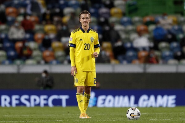 FILE - Sweden's Kristoffer Olsson waits to take a free kick during the UEFA Nations League soccer match between Portugal and Sweden at the Jose Alvalade stadium in Lisbon, Wednesday, Oct. 14, 2020. Sweden midfielder Kristoffer Olsson who was hospitalized last month with an acute brain condition, is in a stable condition but remains in intensive care, his Danish club FC Midtjylland said Thursday, March 7, 2024, adding doctors will slowly take him out on the ventilator. (AP Photo/Armando Franca, File)