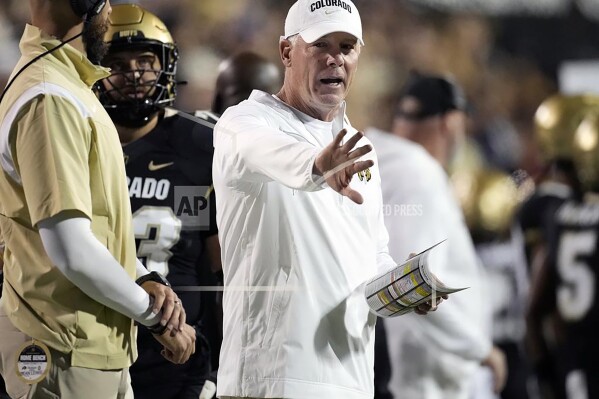 FILE - Then Colorado quality control analyst Pat Shurmur, right, gestures in the second half of an NCAA college football game against Colorado State, Sept. 16, 2023, in Boulder, Colo. Shurmur is entering his first full season as Colorado's offensive coordinator after calling plays for the team's final four contests in 2023. (AP Photo/David Zalubowski, File)