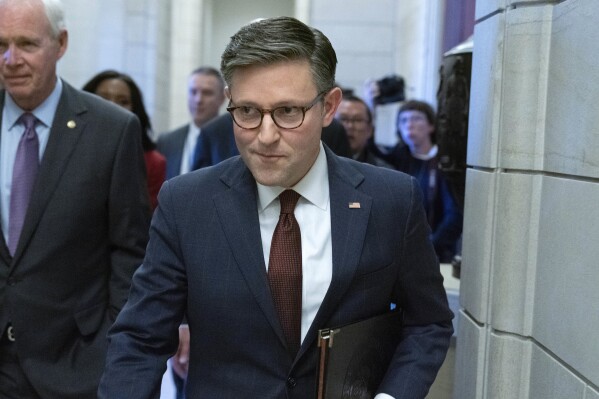 Speaker of the House Rep. Mike Johnson, R-La., walks to the senate side for lunch with Senate GOP members at the Capitol Washington, Wednesday, Nov. 1, 2023. (AP Photo/Jose Luis Magana)