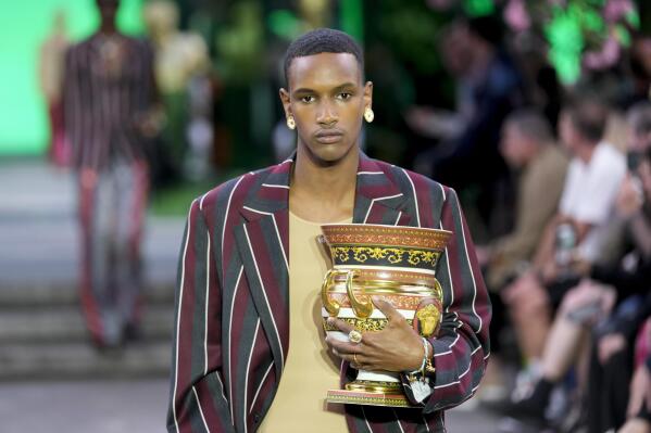 A model wears a creation as part of the Versace men's Spring Summer 2023 collection presented in Milan, Italy, Saturday, June 18, 2022. (AP Photo/Luca Bruno)