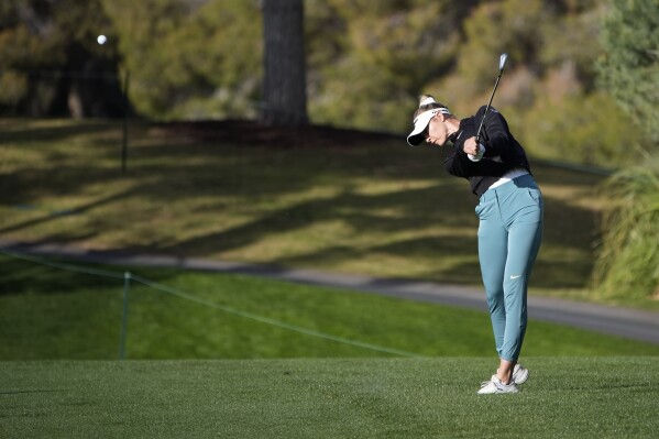 Nelly Korda hits from the rough along the 10th fairway during the second round of the LPGA T-Mobile Match Play golf tournament Thursday, April 4, 2024, in North Las Vegas, Nev. (AP Photo/John Locher)