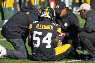 Pittsburgh Steelers linebacker Kwon Alexander (54) is examined by team doctors and trainers after being injured on a play during the first half of an NFL football game against the Green Bay Packers in Pittsburgh, Sunday, Nov. 12, 2023. (AP Photo/Gene J. Puskar)