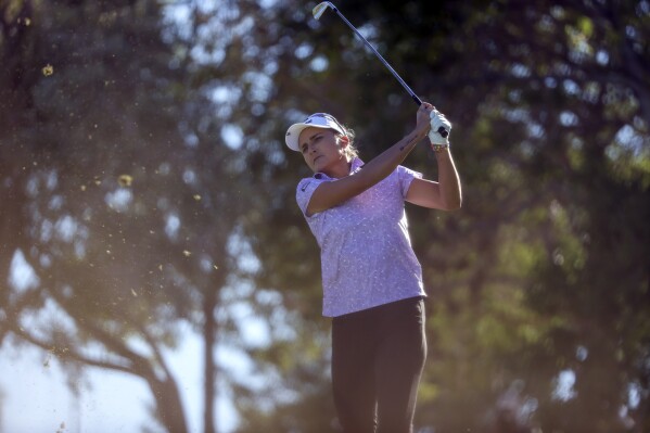 Lexi Thompson follows through with her tee shot on the eighth hole during the first day of the Shriners Children's Open golf tournament, Thursday, Oct. 12, 2023, in Las Vegas. (AP Photo/Ian Maule)