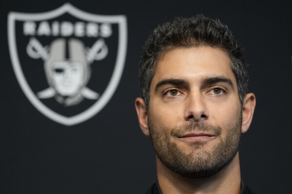 FILE - Las Vegas Raiders quarterback Jimmy Garoppolo takes questions at a news conference Friday, March 17, 2023, in Henderson, Nev. The Las Vegas Raiders enter training camp off a 6-11 season. They signed Garoppolo in the offseason, but he missed OTAs with a foot injury. (AP Photo/John Locher, File)