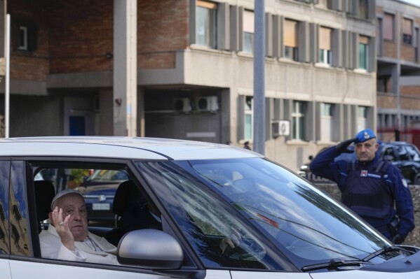 Pope Francis leaves the Rebibbia Prison where he symbolically opened a Holy Door with inmates in Rome, Thursday, Dec. 26, 2024. (AP Photo/Gregorio Borgia, file)