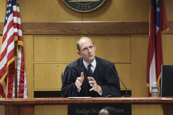 Fulton County Superior Judge Scott McAfee hears motions from attorneys representing Ken Chesebro and Sidney Powell in Atlanta on Wednesday, Sept. 6, 2023. (Jason Getz/Atlanta Journal-Constitution via AP, Pool)