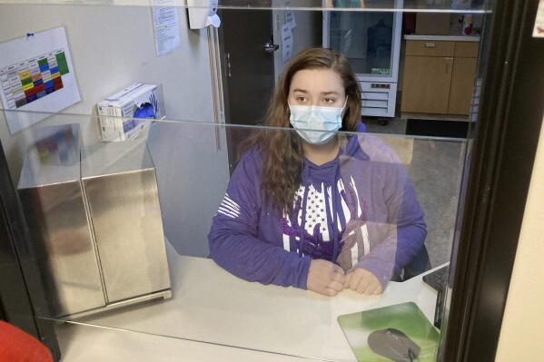 FILE—Vanessa Caudel, a nurse, sits at her work station in the Great Circle treatment center  on Feb. 24, 2022, in Salem, Ore., where she provides doses of methadone, which can relieve the "dope sick" symptoms a person in opioid withdrawal experiences. Almost two years after Oregonians voted to decriminalize drugs and dedicate hundreds of millions of dollars to treatment services, the pioneering effort has been struggling to show progress. (AP Photo/Andrew Selsky, File)