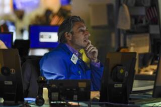 A trader works on the floor at the New York Stock Exchange in New York, Thursday, May 19, 2022. Stocks fell in morning trading on Wall Street Thursday, deepening a slump for major indexes as persistently high inflation continues to weigh on the economy.  (AP Photo/Seth Wenig)