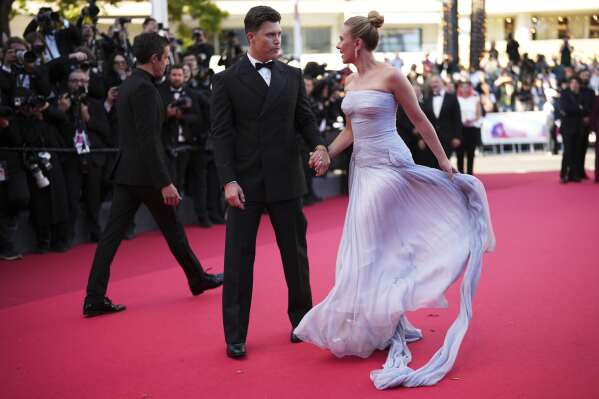 Colin Jost, left, and Scarlett Johansson pose for photographers upon arrival at the premiere of the film 'A Private Life' at the 78th international film festival, Cannes, southern France, Tuesday, May 20, 2025. (Photo by Scott A Garfitt/Invision/AP)