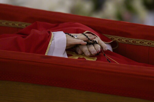 Pope Francis's body is laid out in state inside his private chapel at the Vatican, Monday, April 21, 2025. (Vatican Media via AP, HO)