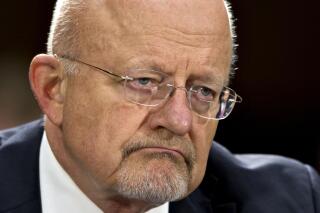 FILE - In this April 18, 2013 file photo, National Intelligence Director James Clapper testifies on Capitol Hill in Washington. The White House and key lawmakers are standing by Clapper despite his admission that he gave misleading statements to Congress on the how much the U.S. spies on its own. Clapper’s apology to lawmakers was made public the first week in July. In March he said that U.S. spies do not gather data on Americans _ something National Security Agency leaker Edward Snowden revealed as false by releasing documents showing the NSA collects millions of U.S. phone records (AP Photo/J. Scott Applewhite, File)