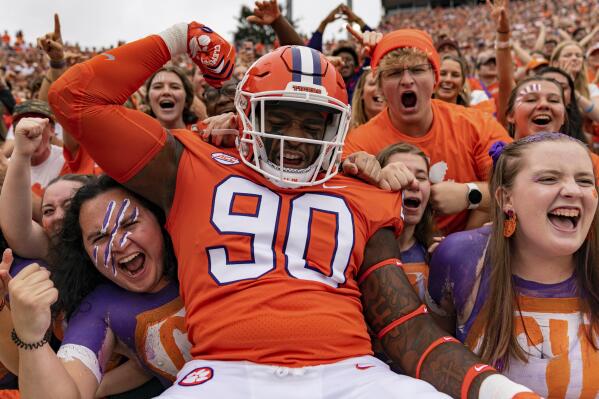 Clemson Tigers defensive tackle Jabriel Robinson (90) pumps up the crowd before an NCAA college football game against the Furman Paladins in Clemson, S.C., Saturday, Sept. 10, 2022. (AP Photo/Jacob Kupferman)