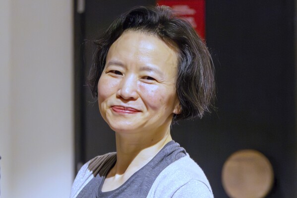 FILE - Australian journalist Cheng Lei smiles after she arrives at Tullamarine Airport in Melbourne on Wednesday Oct. 11, 2023. Lei says she spent more than three years in detention in China for breaking an embargo with a television broadcast. (Sarah Hodges/DFAT via AP, FILE)