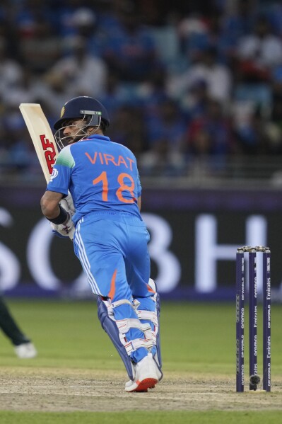 India's Virat Kohli plays a shot during the ICC Champions Trophy cricket match between India and Pakistan at Dubai International Cricket Stadium, United Arab Emirates, Sunday, Feb. 23, 2025. (AP Photo/Altaf Qadri)