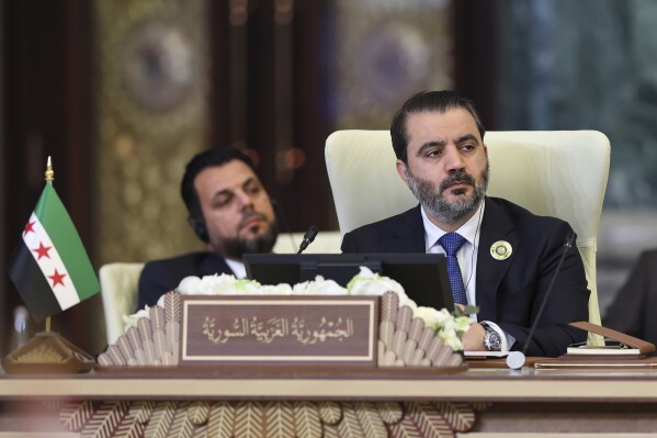 Syrian Foreign Minister Asaad al-Shibani attends the 34th Arab League summit, in Baghdad, Iraq, Saturday, May 17, 2025. (Thaier Al-Sudani/Pool via AP)