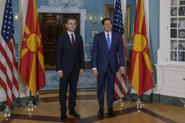 Secretary of State Marco Rubio, right, and North Macedonian Foreign Minister Timčo Mucunski, left, pose for a photo opportunity at the State Department, Thursday, May 29, 2025, in Washington. (AP Photo/Rod Lamkey, Jr.)