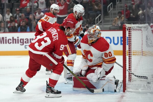 Alex DeBrincat notches hat trick as the Red Wings win fifth straight by  downing Flames 6-2
