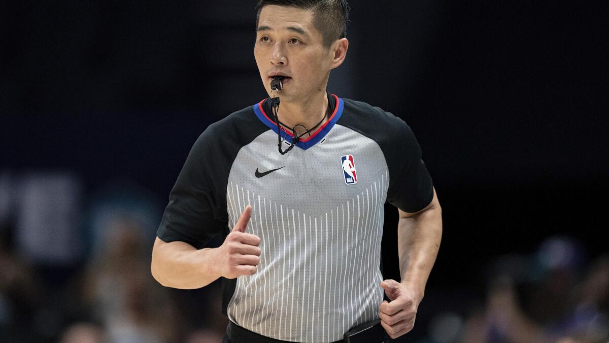 a la deriva ayudante Fácil de comprender For one referee, path from Korea to the NBA wasn't easy | AP News