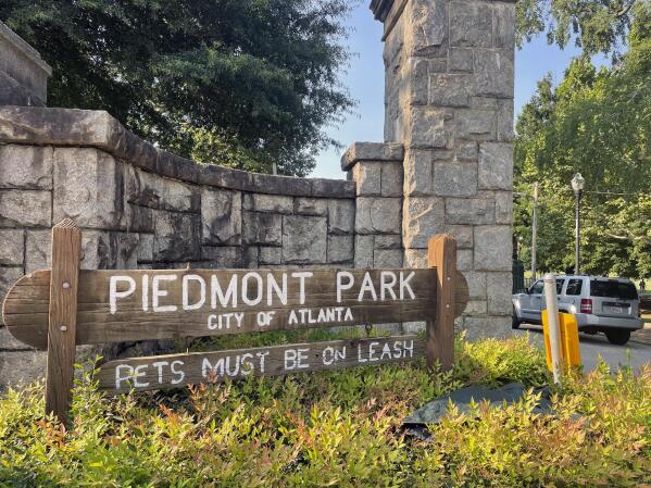 Authorities are searching for the person who fatally stabbed a woman who was walking her dog in Piedmont Park, one of Atlanta's most popular parks, Wednesday, July 28, 2021 in Atlanta. Katherine Janness, 40, was found dead in Piedmont Park around 1 a.m. Wednesday, police said. Her dog had also been killed. (AP Photo/R.J. Rico)