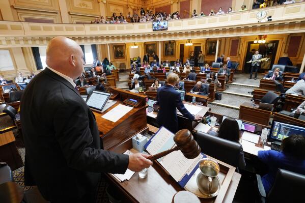 FILE - Speaker of the Virginia House of Delegates, Del. Todd Gilbert, R-Shenandoah, left, gavels to order the special session of the Virginia General Assembly, on Sept. 7, 2022, in Richmond, Va. The politically divided Virginia General Assembly churned through hundreds of bills Tuesday, Feb. 7, 2023, as it approached a key deadline for the year's legislative session. (AP Photo/Steve Helber, File)
