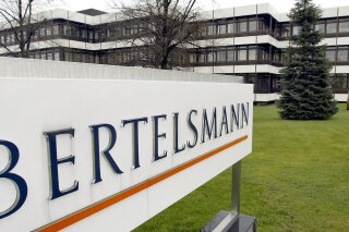 FILE -- This March 13, 2003 file photo shows an exterior view of the German media giant Bertelsmann in Guetersloh, Germany. German media giant Bertelsmann said Wednesday that it is buying publisher Simon & Schuster from ViacomCBS for $2.17 billion in cash. (AP Photo/Michael Sohn, file)