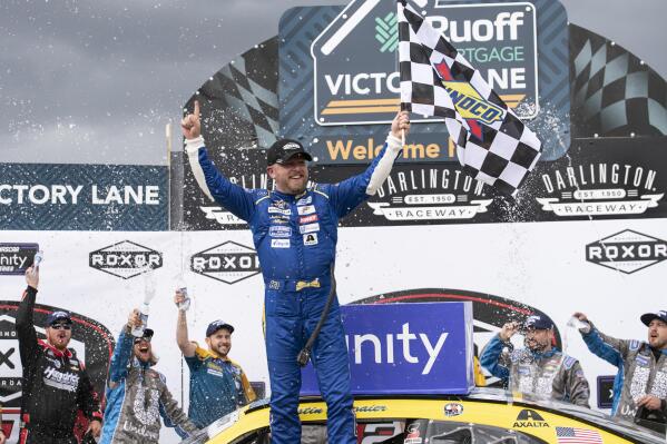 Justin Allgaier (7) celebrates in Victory Lane after winning the NASCAR Xfinity auto race at the Darlington Raceway on Saturday, May 7, 2022, in Darlington, S.C. (AP Photo/Matt Kelley)