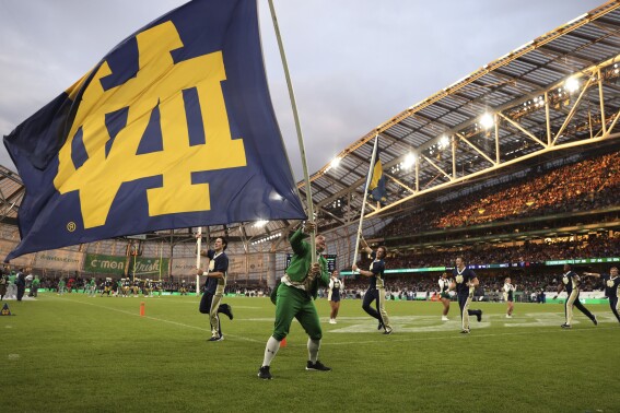 Notre Dame celebrates a touchdown against Navy during the first half of an NCAA college football game in Dublin, Ireland, Aug. 26, 2023. (AP Photo/Peter Morrison)