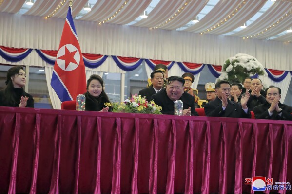 In this photo provided by the North Korean government, North Korean leader Kim Jong Un, center, with his daughter and his wife Ri Sol Ju, left, attends a performance to celebrate the New Year in Pyongyang, North Korea, Sunday, Dec. 31, 2023. Independent journalists were not given access to cover the event depicted in this image distributed by the North Korean government. The content of this image is as provided and cannot be independently verified. Korean language watermark on image as provided by source reads: "KCNA" which is the abbreviation for Korean Central News Agency. (Korean Central News Agency/Korea News Service via AP)