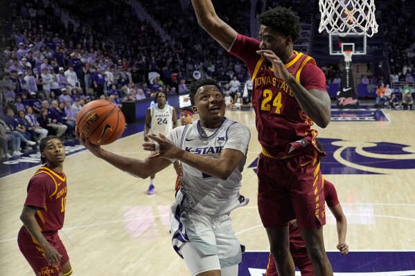 Kansas State guard Tylor Perry looks to shoot under pressure from Iowa State forward Hason Ward (24) during the second half of an NCAA college basketball game Saturday, March 9, 2024, in Manhattan, Kan. Kansas State won 65-58. (AP Photo/Charlie Riedel)