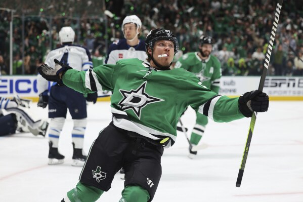 Dallas Stars center Mikael Granlund celebrates after scoring a power play goal against the Winnipeg Jets in the first period of Game 4 of a second-round NHL hockey playoff series in Dallas, Tuesday, May 13, 2025. (AP Photo/Gareth Patterson)